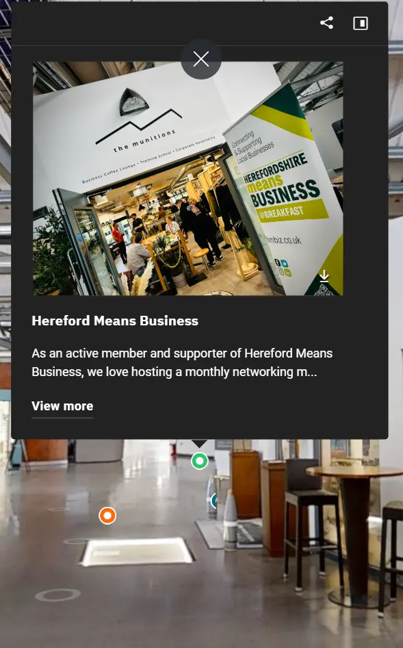 Capture d’un espace de coworking dynamique, &#34;The Munitions&#34;, mettant en avant une ambiance collaborative et professionnelle. L’image montre un événement de networking organisé par Hereford Means Business, avec une signalétique visible indiquant &#34;#BREAKFAST @BREAKFAST&#34;. Plusieurs personnes sont visibles en train d’échanger et de travailler dans un cadre moderne et lumineux, entouré de plantes et d’un mobilier design. Cet espace est idéal pour les entrepreneurs, les freelances et les professionnels souhaitant développer leur réseau et participer à des rencontres mensuelles. L’affichage met en avant l’engagement actif de l’espace dans le soutien aux entreprises locales et aux opportunités de collaboration.